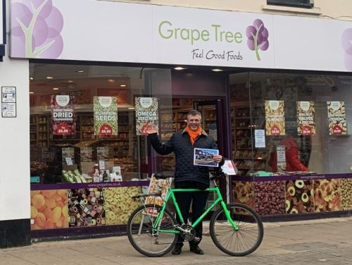 Martin Clark stood outside property with his bike